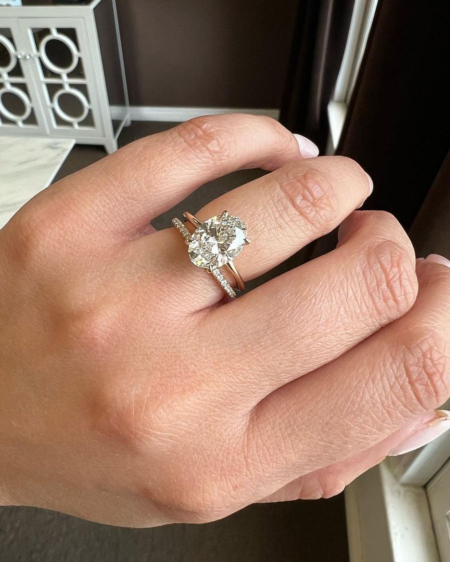 Oval diamond ring on a hand